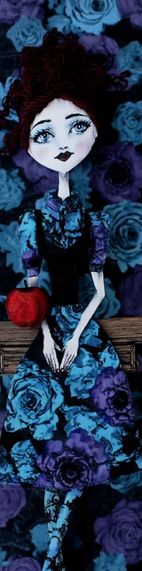 Free teacher bookmark featuring a female teacher with blue flowers and an apple